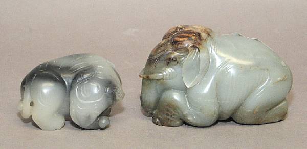 Appraisal: Two jade models of elephant Each depicting a recumbent elephant