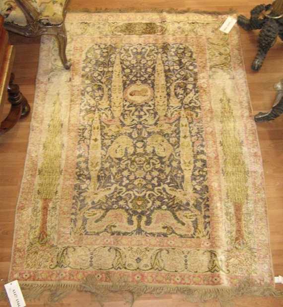 Appraisal: KAYSERI SILK antique Dark central field decorated with plants and