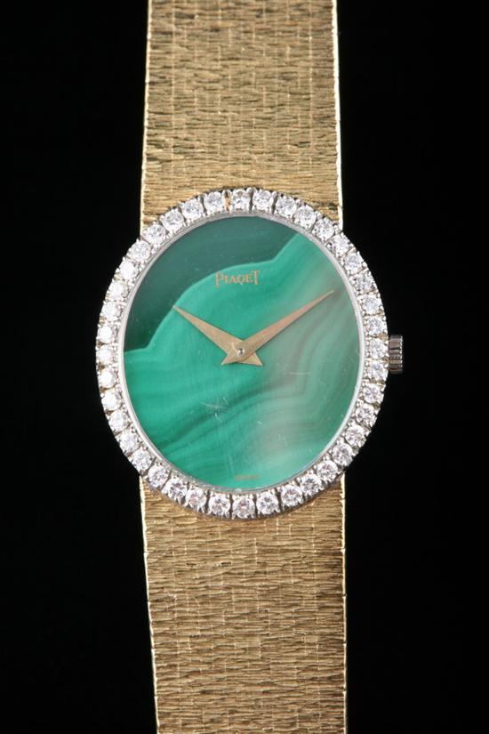 Appraisal: PIAGET K YELLOW GOLD MALACHITE AND DIAMOND WRIST WATCH Oval