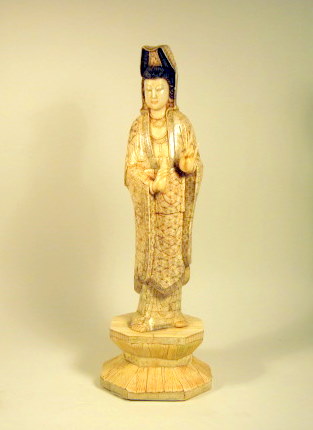 Appraisal: Chinese bone model of QuanyinTall standing Goddess of Mercy over