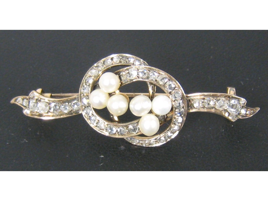 Appraisal: A Pearl and Diamond Knot Brooch pav -set numerous rose-cut