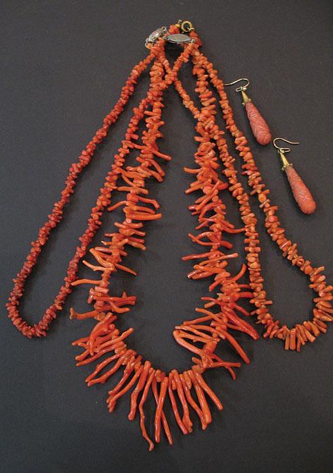 Appraisal: THREE RED CORAL NECKLACES together with a pair of carved