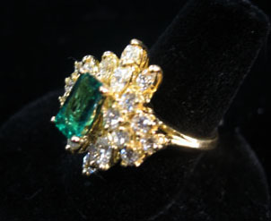 Appraisal: karat yellow gold emerald and diamond cluster ring Traditional diamond