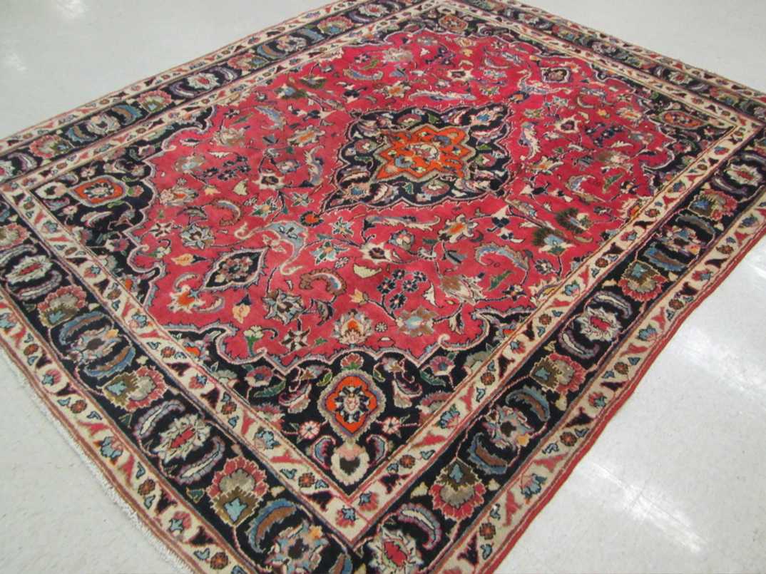 Appraisal: SEMI-ANTIQUE PERSIAN CARPET floral and central floral medallion design on