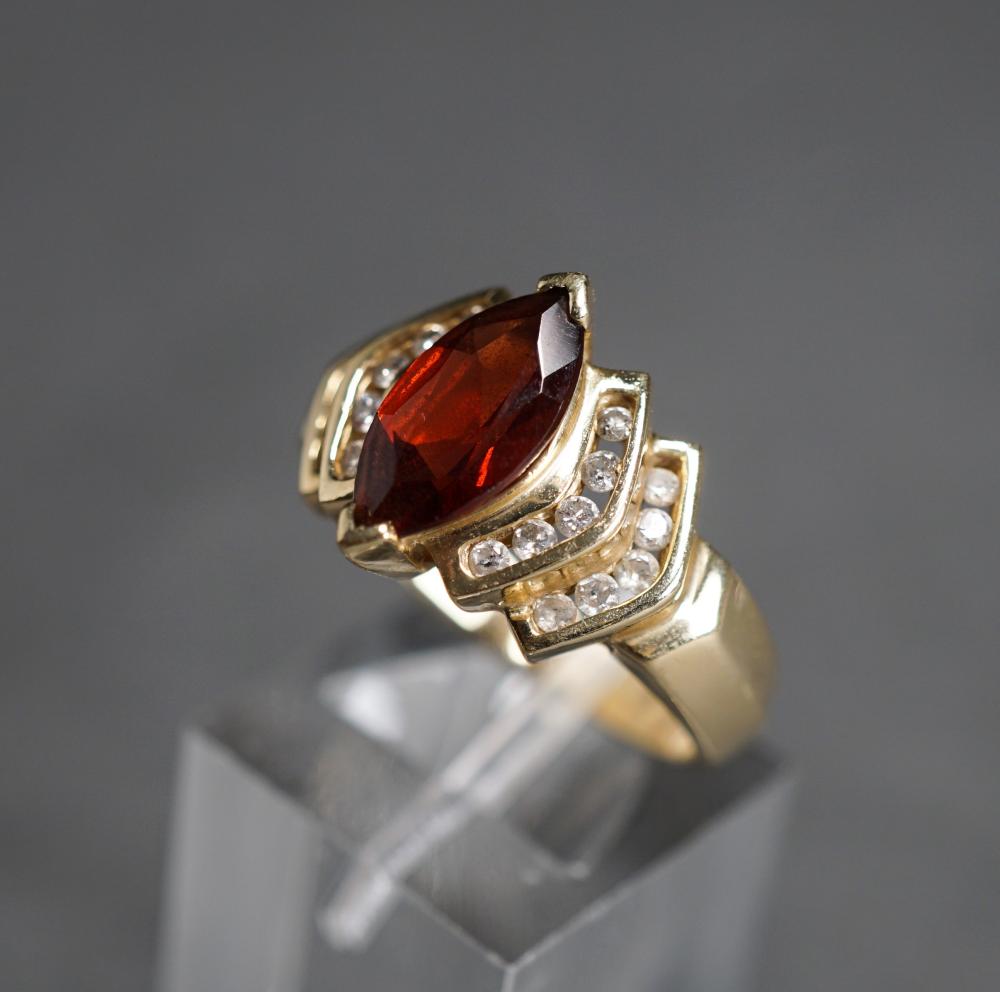 Appraisal: -KARAT YELLOW-GOLD GARNET AND DIAMOND RING GROSS DWT SIZE -Karat