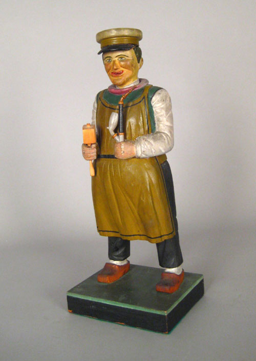 Appraisal: German carved and painted figure of a man holding a