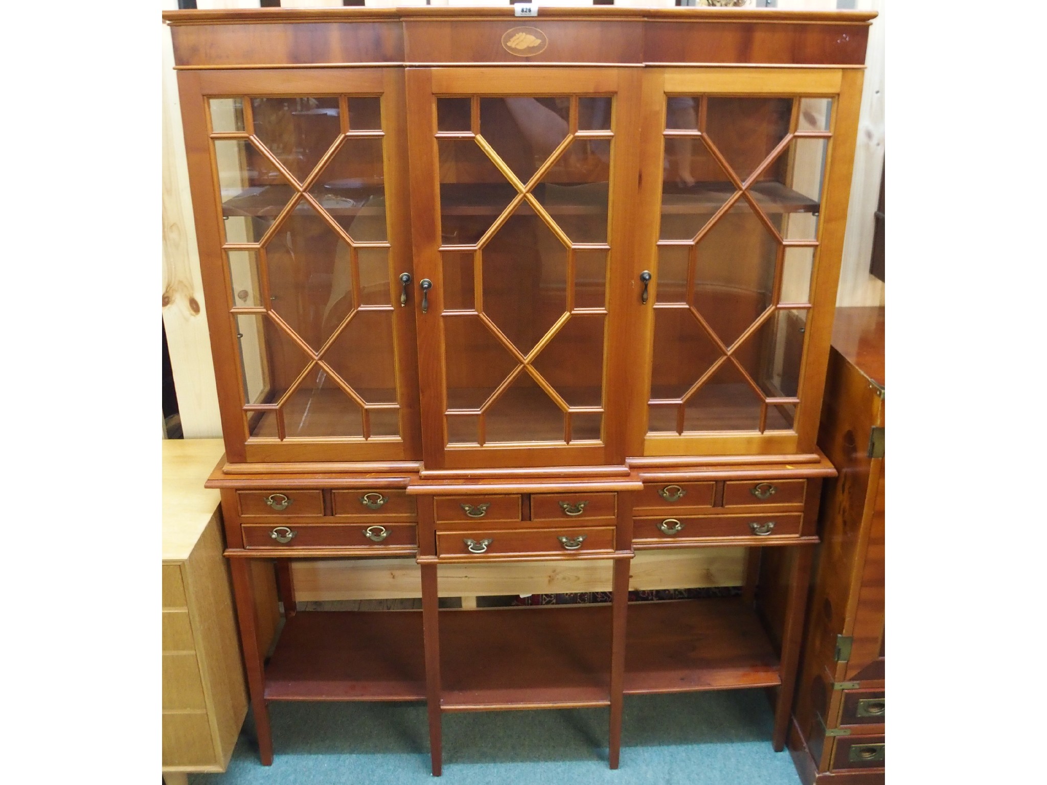 Appraisal: A th Century yew wood glazed bookcase on stand