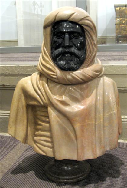 Appraisal: Mixed marble bust of a Moor In brown and black