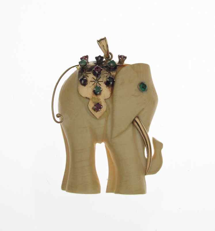 Appraisal: IVORY AND GEMSTONE ELEPHANT PENDANT K yellow gold with ivory