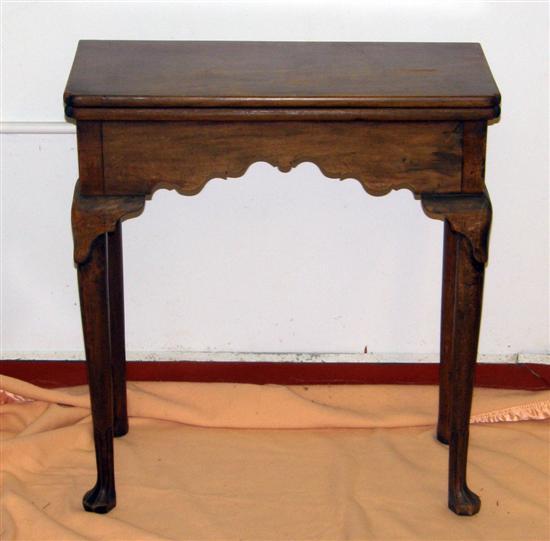 Appraisal: A GEORGE II MAHOGANY TEA TABLE the tapering legs with