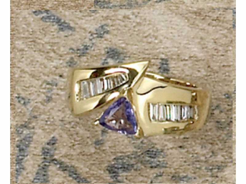 Appraisal: TANZANITE AND DIAMOND RING Featuring one triangular cut Tanzanite approximately