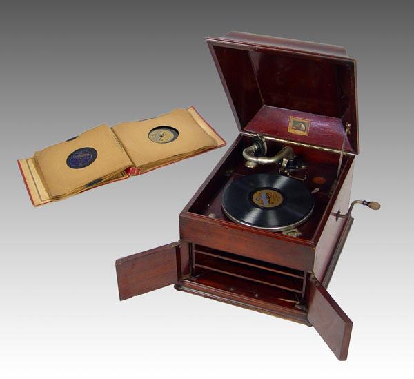 Appraisal: MAHOGANY GRAMOPHONE MODEL WITH RECORDS Mahogany case Cranks and spins