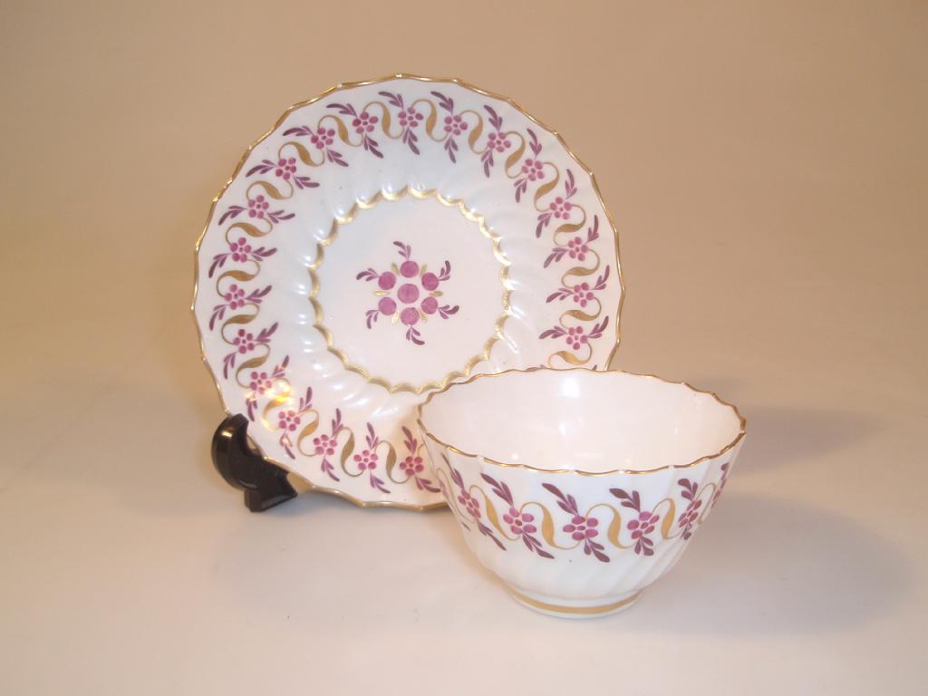 Appraisal: An thC Worcester spirally fluted tea bowl and saucer painted