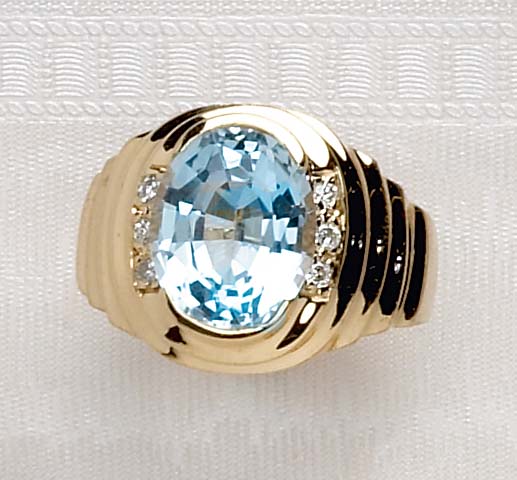 Appraisal: BLUE TOPAZ RING k yellow gold ring with fluted design