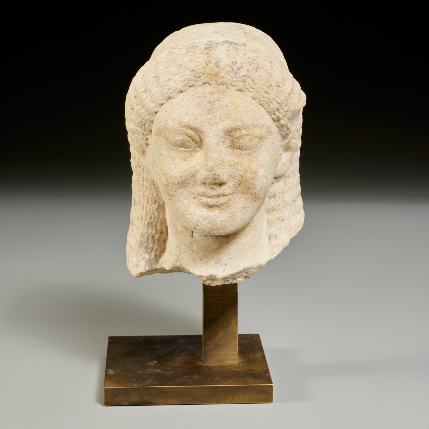 Appraisal: GREEK STYLE MARBLE HEAD OF A KORE th c or