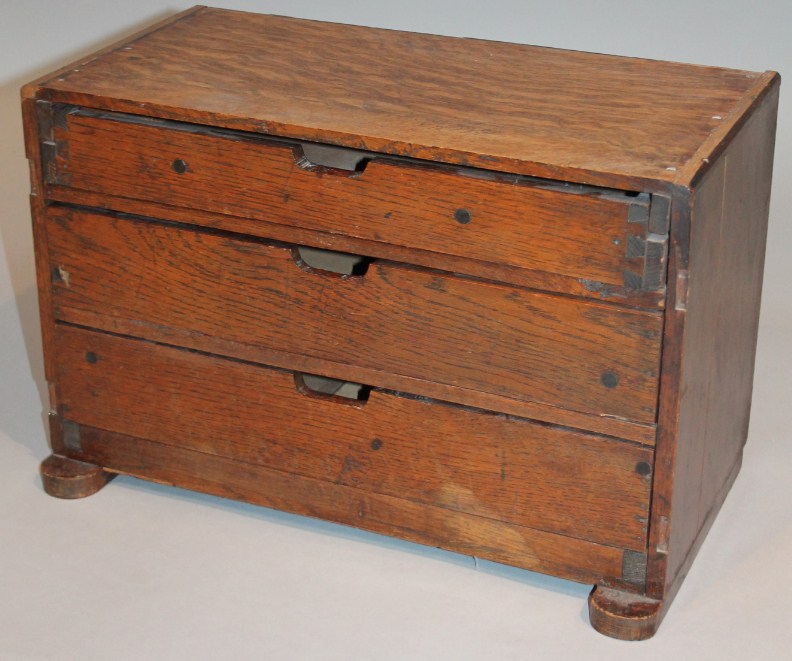 Appraisal: An early thC oak table cabinet with three flush front