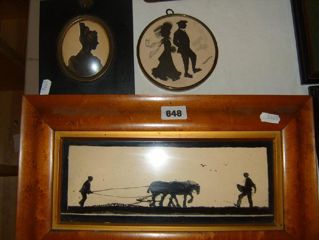 Appraisal: A silhouette picture of a ploughing team in a maple