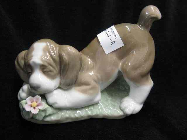 Appraisal: Lladro Porcelain Figurine of a Puppy withflower '' long ''