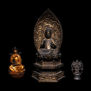 Appraisal: Three Buddhas comprising two bigger wood examples and one small