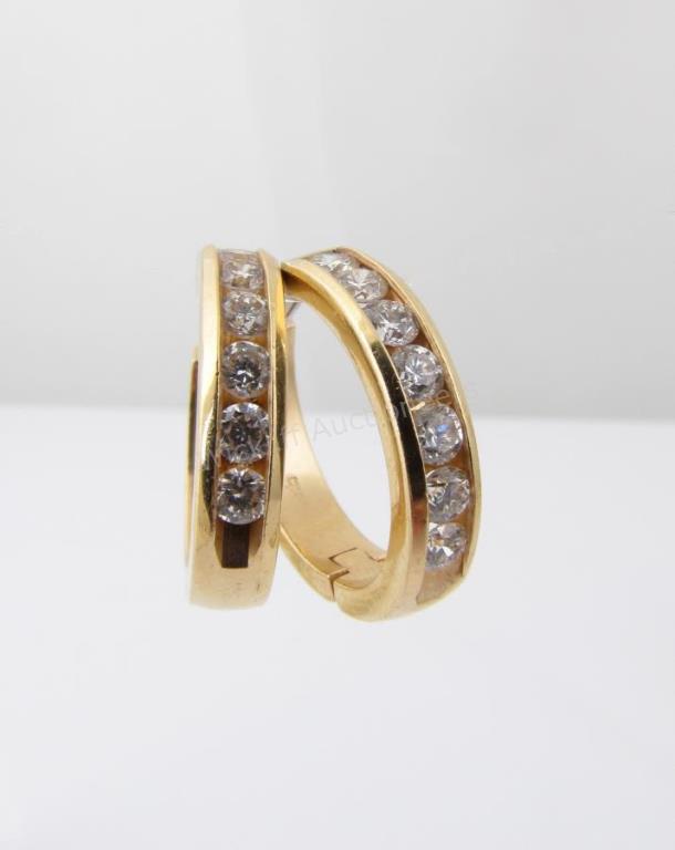 Appraisal: A pair of K yellow gold hoop earrings each containing