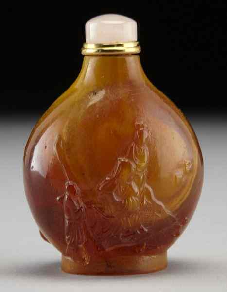 Appraisal: Chinese carved amber snuff bottledepicting figures in a landscape ''H