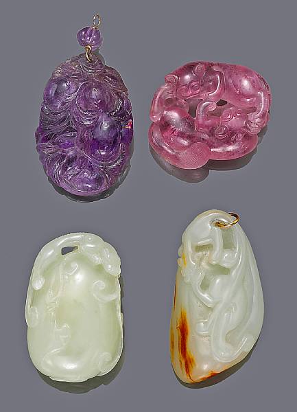 Appraisal: A group of four hardstone pendants The first a pink