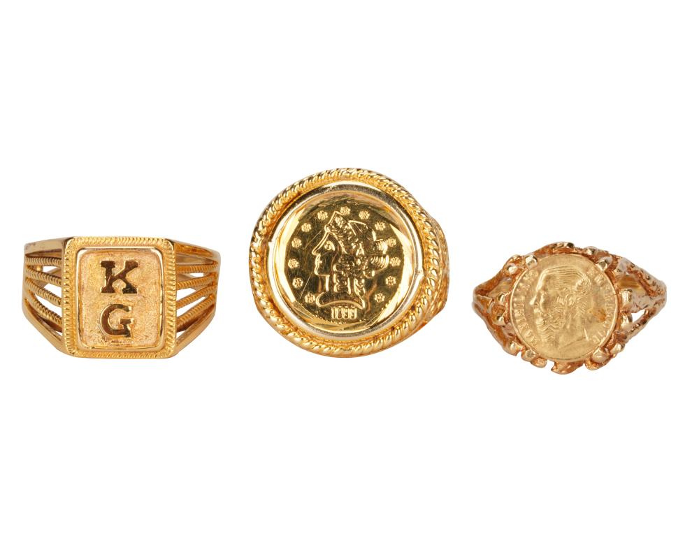 Appraisal: THREE KARAT YELLOW GOLD RINGScomprising one with Liberty head style