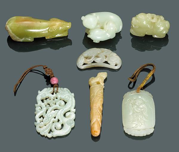 Appraisal: A group of seven jade carvings Including two rectangular pendants