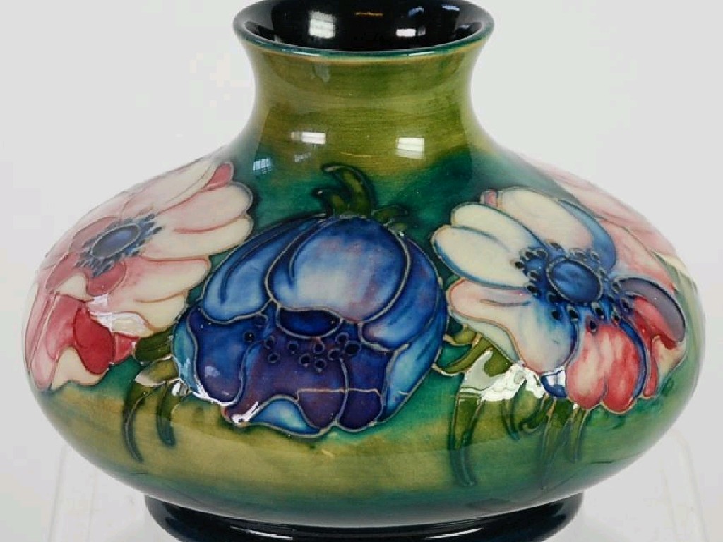 Appraisal: WALTER MOORCROFT ANEMONE PATTERN TUBE LINED POTTERY VASE circular squat