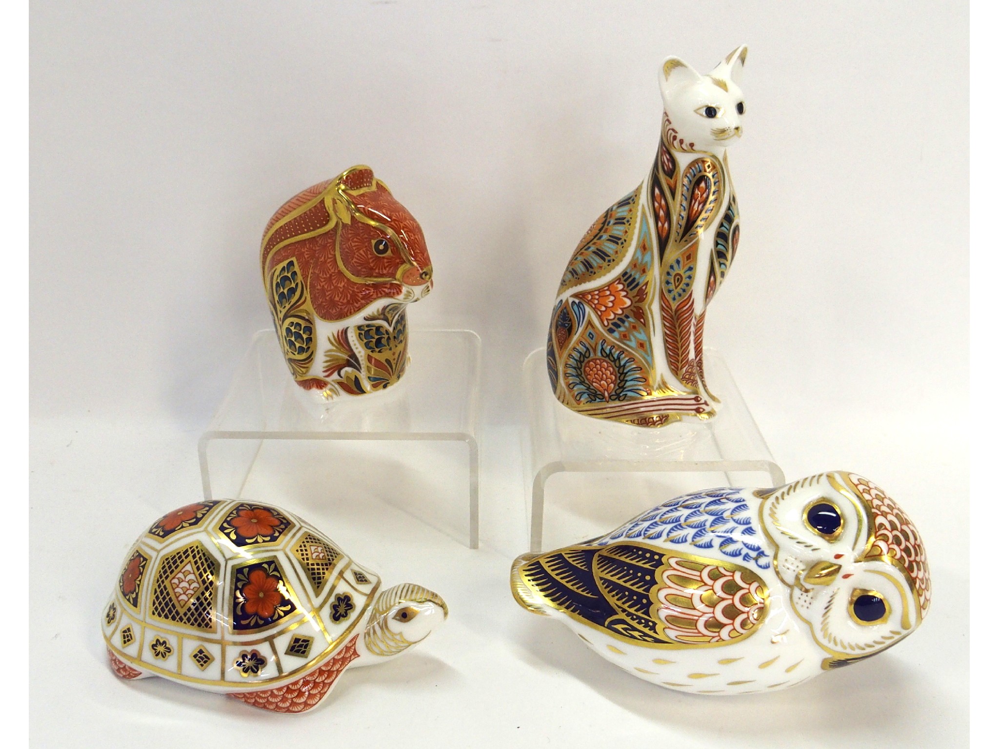 Appraisal: Four Royal Crown Derby paperweights including Squirrel Egyptian cat Tortoise