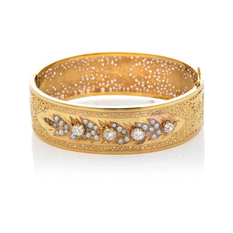 Appraisal: FRENCH DIAMOND AND SEED PEARL GOLD HINGED BANGLE Condition Report