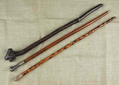 Appraisal: Three walking sticks late th early th c one with