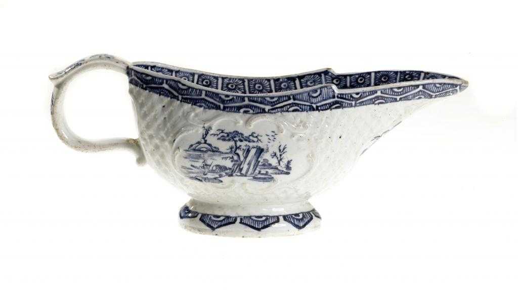 Appraisal: A DERBY SAUCE BOAT moulded with overlapping leaves and three