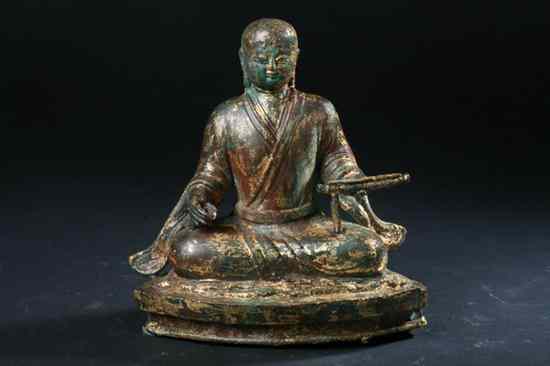 Appraisal: CHINESE GILT BRONZE FIGURE OF MONK Seated in dhyanasana holding