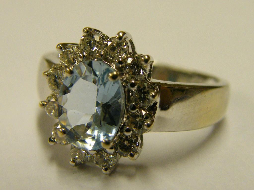 Appraisal: ct white gold oval aquamarine and diamond cluster ring size