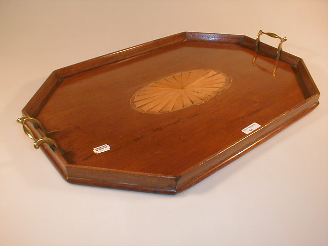 Appraisal: An Edwardian mahogany serving tray with canted and moulded gallery