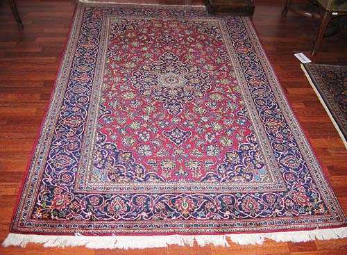 Appraisal: KESHAN old Red ground with blue central medallion decorated with