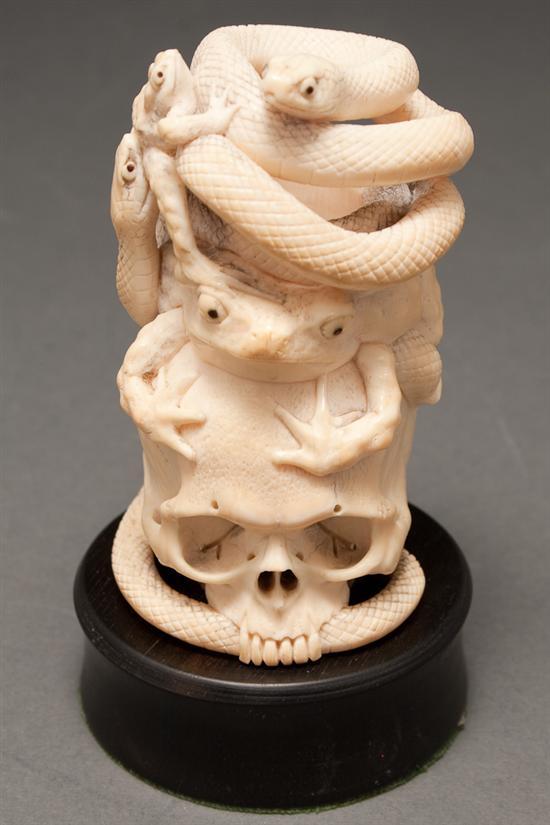 Appraisal: Japanese carved ivory figural group of toads and coiled snake