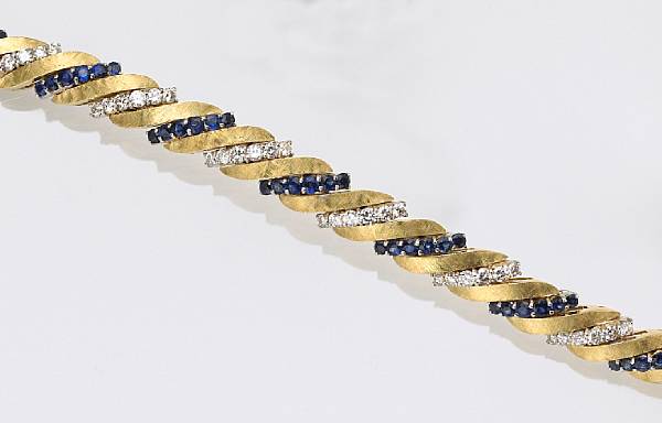 Appraisal: A diamond sapphire and eighteen karat gold bracelet designed as