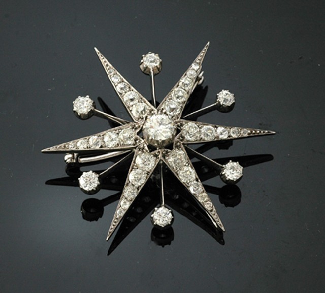 Appraisal: A Victorian diamond starburst brooch Circa Set to the centre