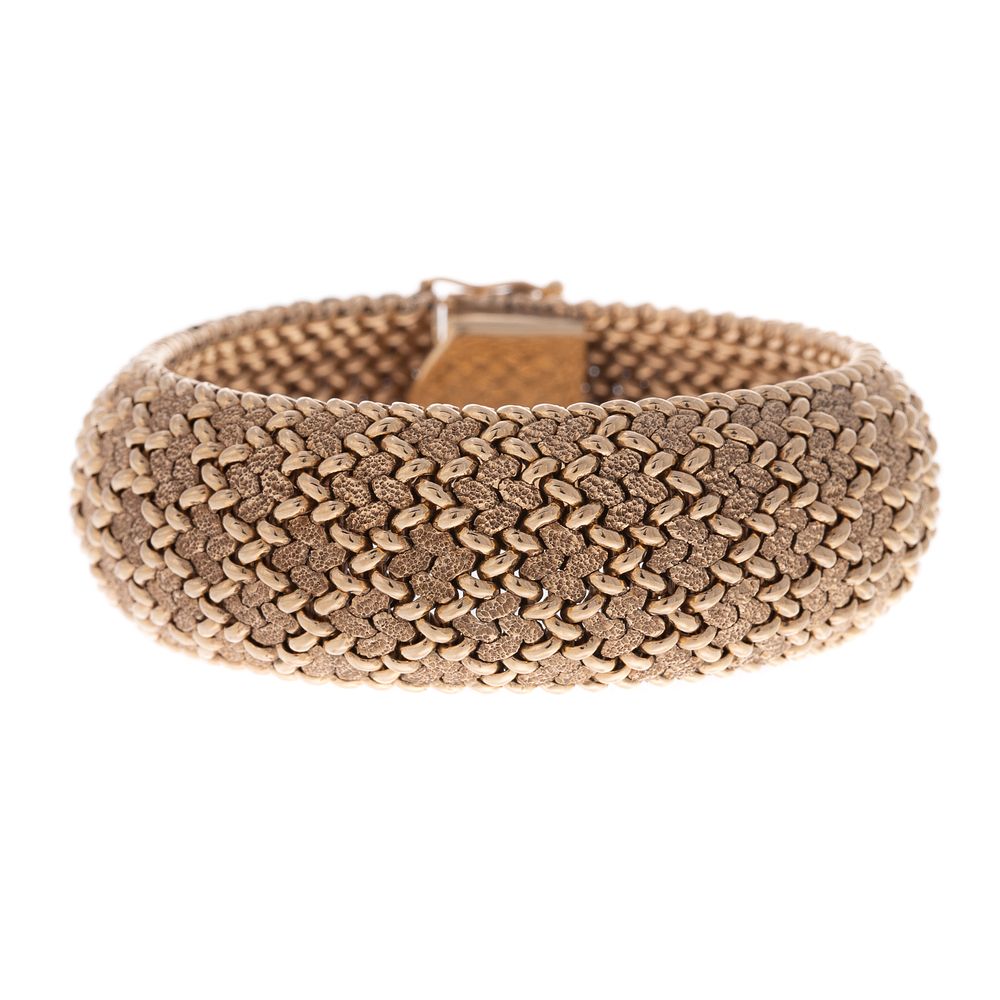 Appraisal: A Wide Textured Bracelet in K K yellow gold bracelet