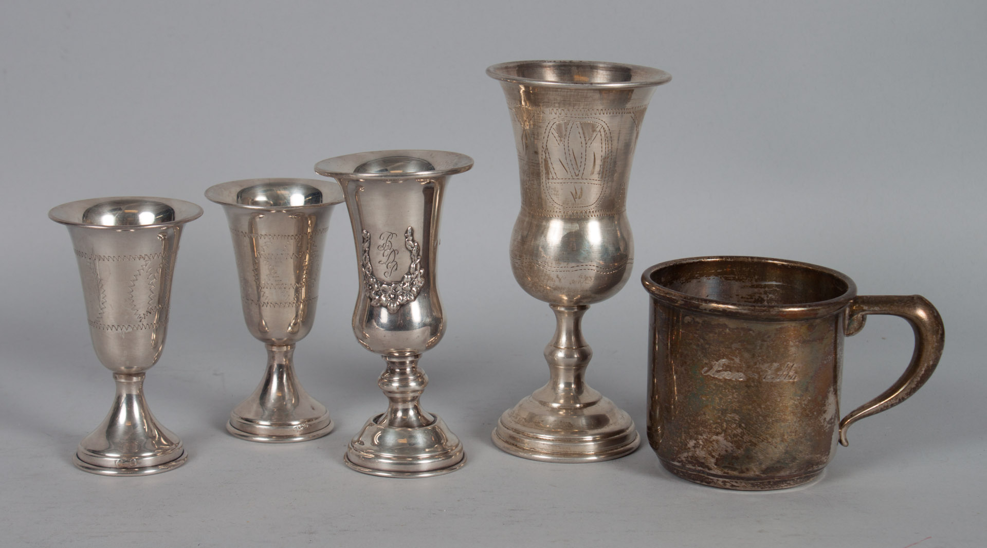 Appraisal: Four sterling silver Kiddush cups in H as to tallest