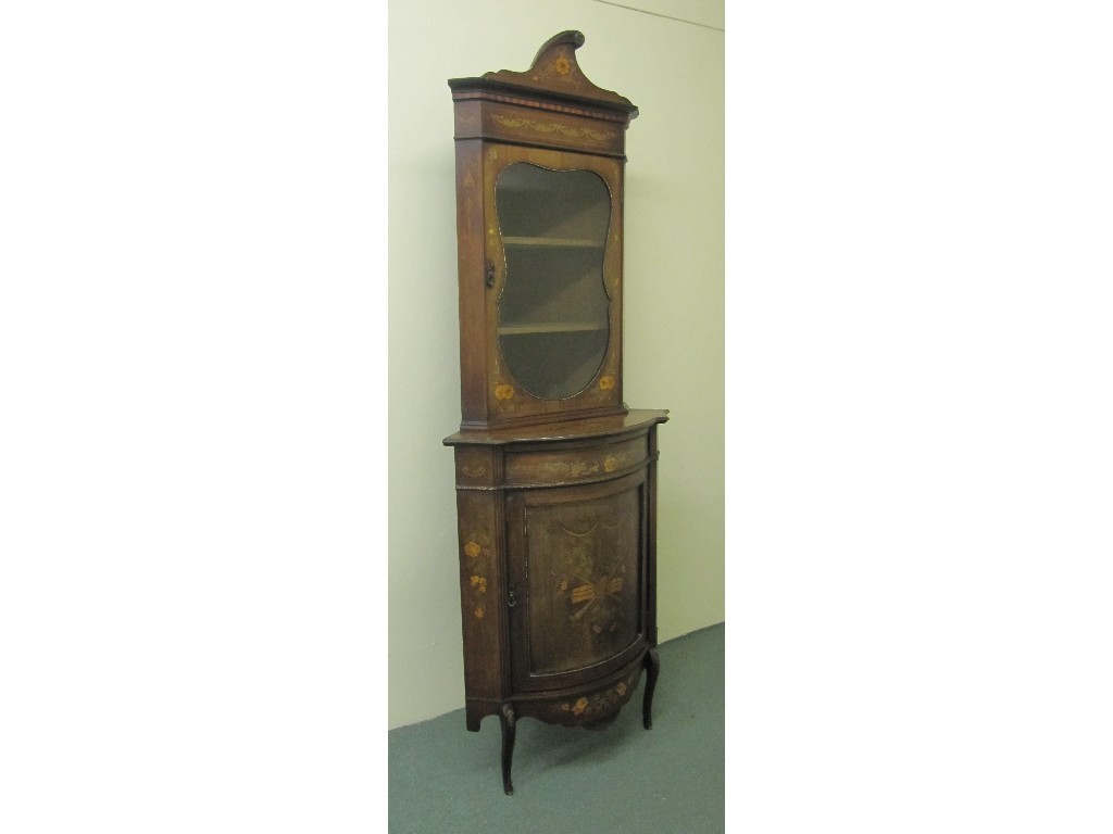 Appraisal: An Edwardian inlaid corner cabinet on cupboard base the top