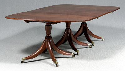 Appraisal: Regency mahogany dining table each of three pedestals with tilting