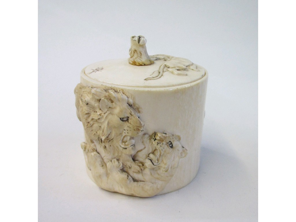 Appraisal: Japanese carved ivory box and cover with big cat decoration