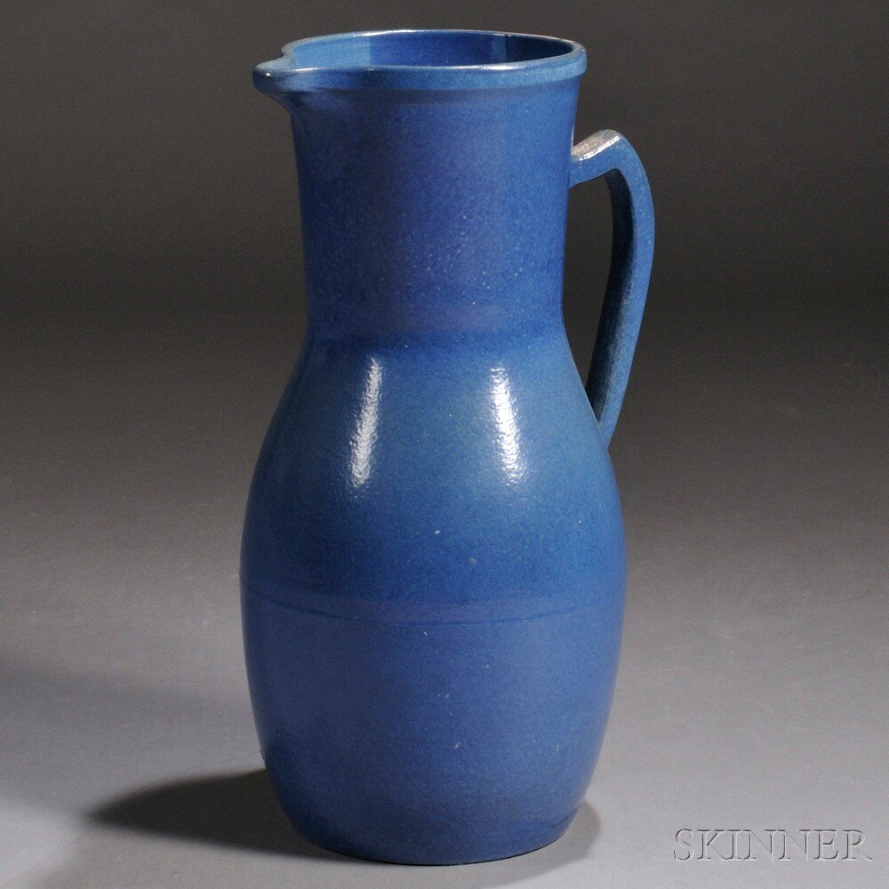 Appraisal: Large Earthenware Pitcher In an overall sky blue semimatte glaze