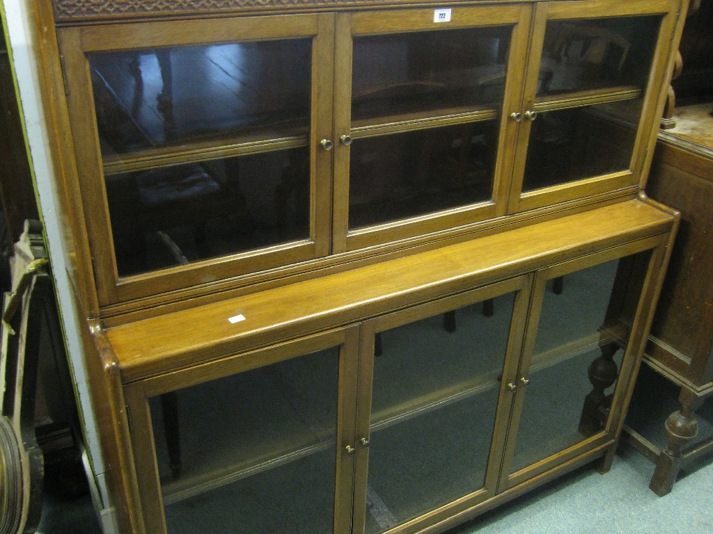 Appraisal: Two section bookcase with blind fret decoration