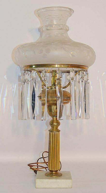 Appraisal: Brass Empire Oil Lamp Cut shade Hung prisms and column