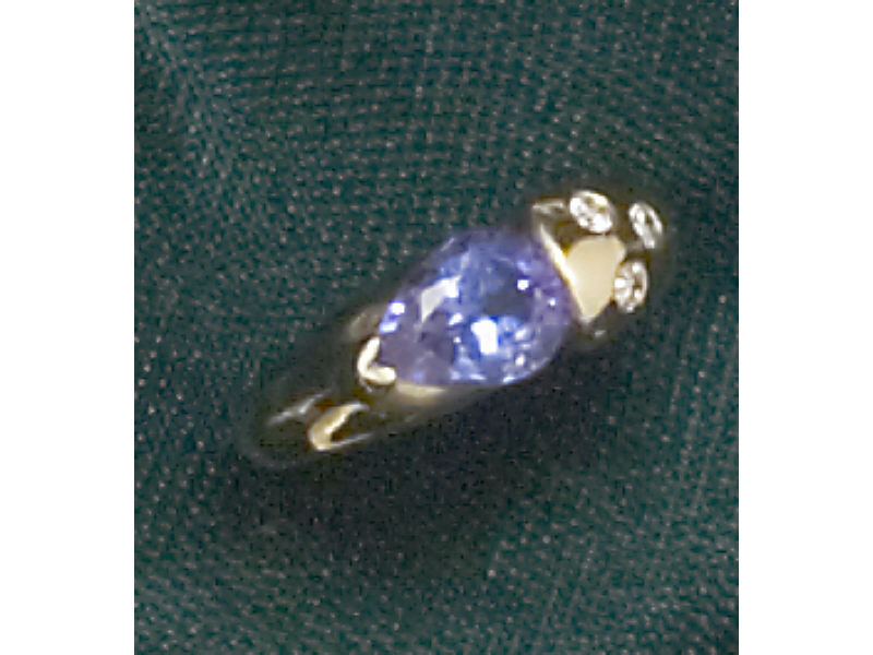 Appraisal: TANZANITE RING k yellow gold lady's ring set with one