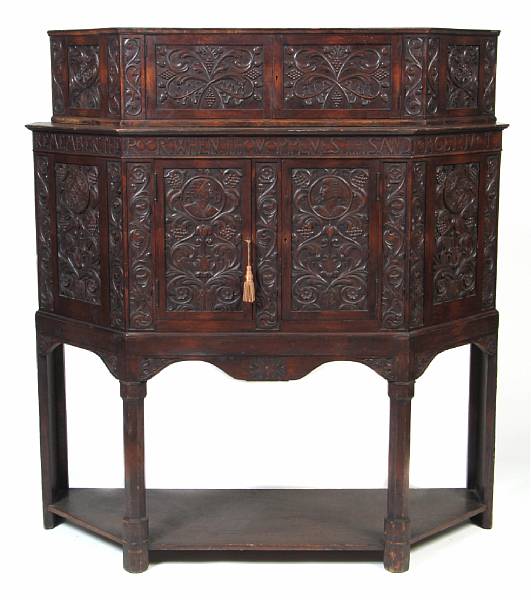 Appraisal: A Renaissance style carved oak two part cabinet height ft